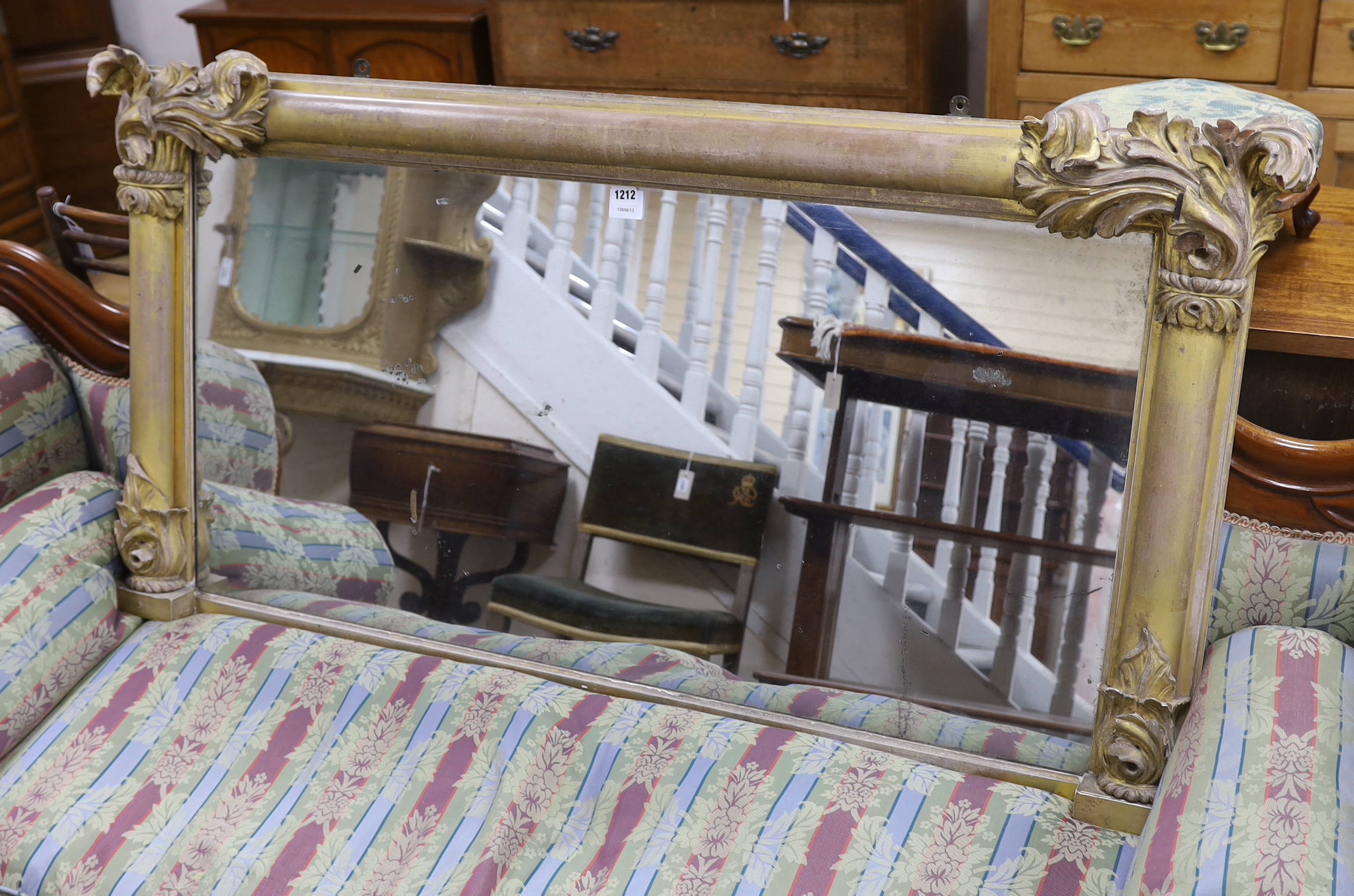 A William IV carved giltwood and composition overmantel mirror, 142 x 70cm